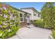 Charming home featuring brick accents, white siding, green trim, and a well-maintained front yard at 13661 W Tufts Ave, Morrison, CO 80465