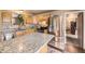 Well-equipped kitchen with granite countertops, stainless steel appliances, and stylish wooden cabinetry at 13661 W Tufts Ave, Morrison, CO 80465
