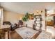 Cozy living room with hardwood floors, tan walls, and lots of natural light at 13661 W Tufts Ave, Morrison, CO 80465