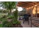 Inviting backyard patio with outdoor seating, a grill, and lush landscaping, ideal for entertaining and relaxation at 7189 S Kline St, Littleton, CO 80127