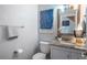 Updated bathroom featuring a stylish vanity, granite countertop, and modern fixtures at 7189 S Kline St, Littleton, CO 80127