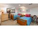 Charming bedroom with twin beds, wood accents, and coordinated decor, providing a comfortable and inviting space at 7189 S Kline St, Littleton, CO 80127