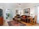 Cozy living room with hardwood floors and sliding door access to outdoor patio at 7189 S Kline St, Littleton, CO 80127