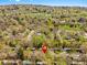 An aerial view featuring a neighborhood with mature landscaping and lush green trees at 6314 Brooks Dr, Arvada, CO 80004