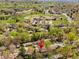 An aerial view showing the property location near a school and grassy park with trees at 6314 Brooks Dr, Arvada, CO 80004