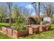Backyard featuring raised garden beds and a well-maintained lawn at 6314 Brooks Dr, Arvada, CO 80004