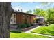 Inviting backyard with a covered patio area, perfect for outdoor dining and entertaining at 6314 Brooks Dr, Arvada, CO 80004