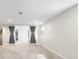 Spacious basement with carpet, recessed lighting, and a separate entrance or storage area at 6314 Brooks Dr, Arvada, CO 80004