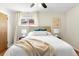 Bedroom with hardwood floors, large windows, and a ceiling fan at 6314 Brooks Dr, Arvada, CO 80004