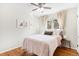 Bedroom featuring hardwood floors, a ceiling fan, and neutral decor at 6314 Brooks Dr, Arvada, CO 80004
