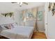 Calm bedroom with stylish accents, hardwood floors, and great lighting at 6314 Brooks Dr, Arvada, CO 80004