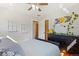 Inviting bedroom with a ceiling fan, hardwood floors, and decor on the walls at 6314 Brooks Dr, Arvada, CO 80004