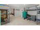 Spacious bedroom featuring bunk beds, a desk, and an open doorway to a living area at 6314 Brooks Dr, Arvada, CO 80004