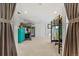 Large bedroom featuring multiple bunkbeds and a desk with bright teal dressers and carpet flooring at 6314 Brooks Dr, Arvada, CO 80004