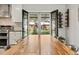 View from dining room, through glass doors, to a large, green backyard at 6314 Brooks Dr, Arvada, CO 80004