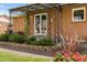 Inviting front porch with decorative metal awning and lush landscaping at 6314 Brooks Dr, Arvada, CO 80004