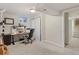 Cozy home office with desk, computer, and closet with white curtains at 6314 Brooks Dr, Arvada, CO 80004