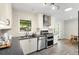 Bright kitchen with stainless appliances, modern cabinets, and eat in space at 6314 Brooks Dr, Arvada, CO 80004