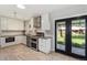 Bright kitchen featuring stainless appliances, modern cabinetry and backyard access at 6314 Brooks Dr, Arvada, CO 80004