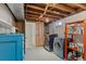 Laundry room with washer, dryer and a blue storage cabinet at 6314 Brooks Dr, Arvada, CO 80004