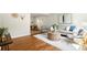 Open living space with hardwood floors, neutral colors, and ample natural light at 6314 Brooks Dr, Arvada, CO 80004