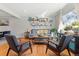 Bright living room features wood floors, ample light, and a cozy seating area at 6314 Brooks Dr, Arvada, CO 80004