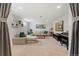 Spacious living room with carpeting, comfortable seating, and a large television at 6314 Brooks Dr, Arvada, CO 80004