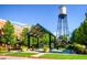 A covered gathering space with a water tower and landscaped park nearby at 6314 Brooks Dr, Arvada, CO 80004