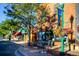 A storefront featuring outdoor seating and colorful awnings in the business district at 6314 Brooks Dr, Arvada, CO 80004
