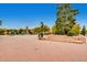 A town square with a clock tower, benches, greenery, and brick paver walkway at 6314 Brooks Dr, Arvada, CO 80004