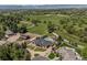 Expansive aerial view of the property, showcasing the home, landscaping, pool, and surrounding acreage at 13962 W 76Th Ln, Arvada, CO 80005