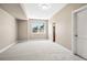 Spacious room has neutral paint, carpet, and a large window at 13962 W 76Th Ln, Arvada, CO 80005