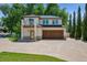 A two-story home with a three-car garage and a balcony at 13962 W 76Th Ln, Arvada, CO 80005
