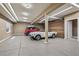 Spacious garage with epoxy floors and room for multiple cars; features natural light at 13962 W 76Th Ln, Arvada, CO 80005