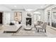 Bright living room features a fireplace, comfortable seating, and a walkout at 13962 W 76Th Ln, Arvada, CO 80005