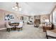 A spacious living room with vaulted ceilings, plantation shutters, and neutral decor at 13962 W 76Th Ln, Arvada, CO 80005