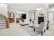 Cozy living room boasts plush seating, fireplace, bar area, and stylish decor at 13962 W 76Th Ln, Arvada, CO 80005