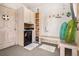 A pool room with a mini fridge, storage, a bench, and pool floats at 13962 W 76Th Ln, Arvada, CO 80005