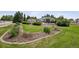 A large, well-maintained yard with mature trees and landscaping at 13962 W 76Th Ln, Arvada, CO 80005