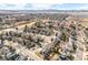 Aerial view of a well-planned community with mature trees and parks at 10873 W 84Th Pl, Arvada, CO 80005