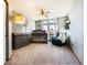 Bedroom showcasing a crib, changing table and cozy chair, decorated with a woodland theme at 10873 W 84Th Pl, Arvada, CO 80005