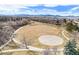 Expansive park featuring a basketball court, walking trail, and green spaces at 10873 W 84Th Pl, Arvada, CO 80005