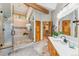 Bathroom features large glass shower, wooden cabinets, modern lighting, and updated fixtures at 434 Kings Crown Rd, Breckenridge, CO 80424