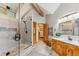 Bathroom featuring large glass shower, wooden cabinets, modern lighting, and natural light at 434 Kings Crown Rd, Breckenridge, CO 80424