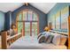 Bedroom with a large window, wood accents, and a cozy atmosphere at 434 Kings Crown Rd, Breckenridge, CO 80424