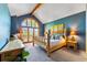 Charming bedroom featuring vaulted ceilings, exposed beams, and large windows with natural light at 434 Kings Crown Rd, Breckenridge, CO 80424