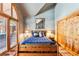 Bedroom featuring light blue walls, wooden bed frame, and natural light at 434 Kings Crown Rd, Breckenridge, CO 80424