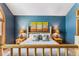 Bedroom featuring a log bed frame, ample lighting, and decorative art pieces at 434 Kings Crown Rd, Breckenridge, CO 80424