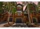 Charming home with multiple balconies, wooden support beams, and attached garages at 434 Kings Crown Rd, Breckenridge, CO 80424