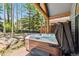 Outdoor hot tub on a wooden deck, surrounded by trees and natural landscaping at 434 Kings Crown Rd, Breckenridge, CO 80424